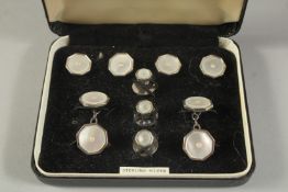 A HARRODS LTD SET OF SILVER AND MOTHER-OF-PEARL DRESS STUDS AND CUFFLINKS, cased.