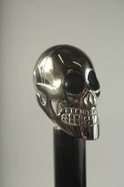 A WALKING STICK WITH CHROME HANDLE "SKULL".