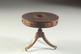 A GOOD REGENCY DESIGN MAHOGANY MINIATURE DRUM TABLE with circular leather top, alternate frieze
