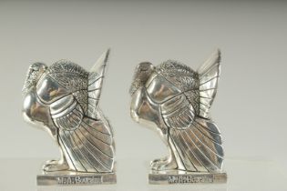 A PAIR OF SILVER PLATE TURKEY SALT AND PEPPERS. 8.5cms high.