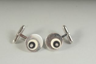 A PAIR OF SILVER, DIAMOND AND ENAMEL CUFFLINKS, boxed.