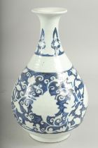 A CHINESE BLUE AND WHITE PORCELAIN VASE, with white floral decoration, character mark to base, 29.