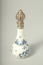 A DELFT PORCELAIN SCENT BOTTLE with silver top. 4ins high.