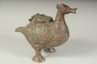 A CHINESE BRONZE ARCHAIC BIRD CENSER. 10ins high.