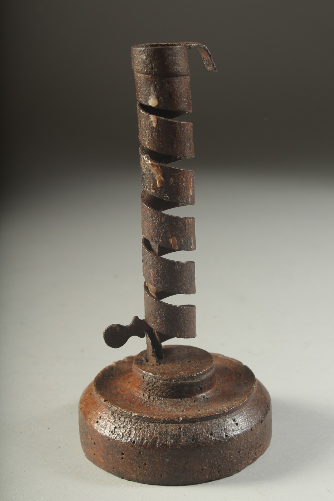 AN EARLY WOODEN AND METAL CANDLESTICK. 8ins high. - Image 2 of 2