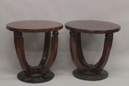 A PAIR OF DECO DESIGN CIRCULAR TABLES on four curving legs. 2ft diameter.