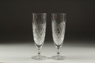 A PAIR OF CUT GLASS WINE FLUTES.