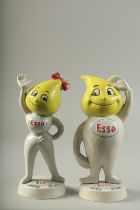 A PAIR OF PAINTED CAST IRON ESSO MONEY BOXES. 9.5ins high.