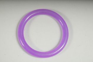 A LAVENDER JADE BANGLE, 2.75ins diameter.