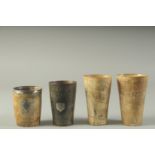 FOUR ENGRAVED HORN BEAKERS. 4.75, 4.5, 4 & 3.5ins. Etched THOMAS with animals, THOMAS with a tree,