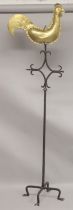 A COCKEREL BRASS WEATHER VANE on a early iron stand.
