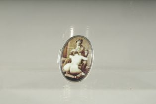 A SILVER PILL BOX, the lid with a painter and model. 3.5cms x 2.5cms.