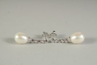 A PAIR OF 18CT WHITE GOLD, DIAMOND AND PEARL DROP EARRINGS.