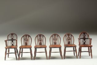A SET OF TWO CARVING AND FOUR SINGLE 18TH CENTURY DESIGN OAK MINIATURE WINDSOR CHAIRS with spindle
