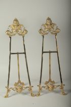 A PAIR OF BRASS EASELS. 23ins high.