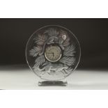 A GOOD LALIQUE CIRCULAR GLASS CLOCK with two panthers. 5ins diameter in a Lalique box.