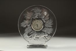 A GOOD LALIQUE CIRCULAR GLASS CLOCK with two panthers. 5ins diameter in a Lalique box.