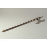 AN ASIAN WAR CLUB with wooden handle. 31ins long.