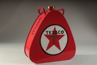 A TEXACO RED OIL CAN.