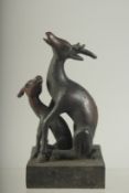 A BRONZE DEER SEAL on a square base. 4.5ins high.