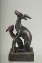 A BRONZE DEER SEAL on a square base. 4.5ins high.