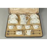 A GOOD MEISSEN PORCELAIN TEA SET in a fitted case, comprising jug with silver mounts, four cups