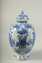 A CHINESE BLUE AND WHITE PORCELAIN JAR AND COVER. 21cms high.