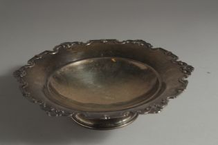 A MAPPIN & WEBB CIRCULAR BOWL with cast shell and scroll border. 8.5ins diameter. Sheffield 1935.