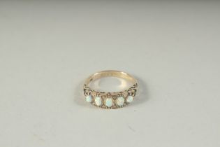 A 9CT GOLD, OPAL AND DIAMOND RING, boxed.