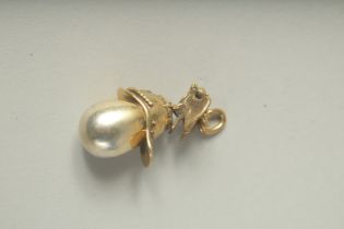 A RUSSIAN SILVER HELMET AND EGG PENDANT.