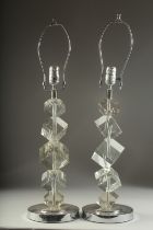A GOOD PAIR OF CUBE DESIGN GLASS LAMPS. 20ins high.