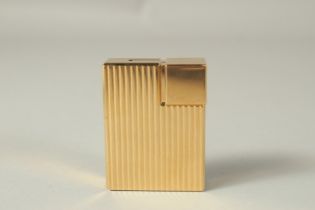 A VERY GOOD GILT METAL CARTIER LIGHTER. No. 448351 in a red Cartier box.