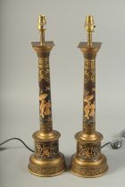 A GOOD PAIR OF TOLEWARE COLUMN LAMPS. 24ins high.
