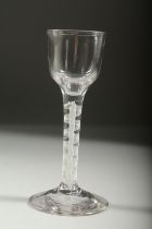 A GEORGIAN WINE GLASS with white air twist stem. 5.5ins high.