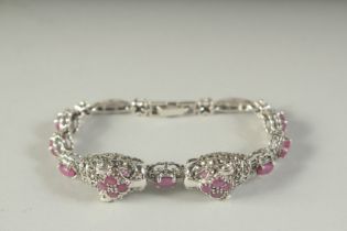 A SILVER RUBY AND MARCASITE PANTHER BRACELET, boxed.