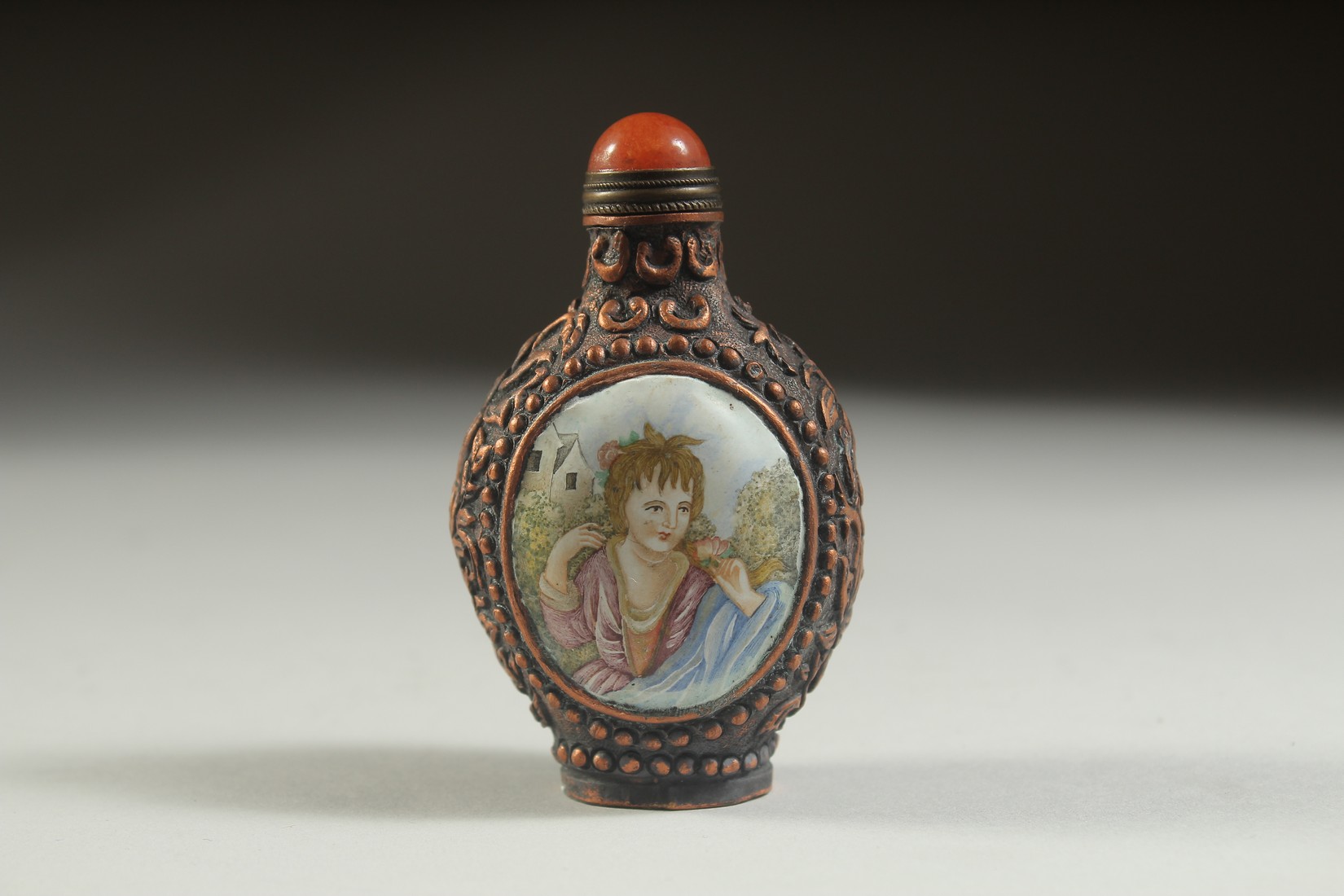 A CHINESE CLOISONNE SNUFF BOTTLE with panels of European ladies.