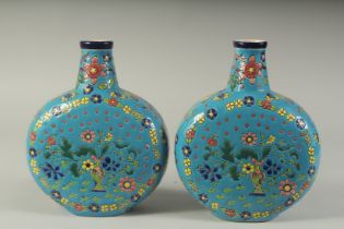 A PAIR OF FRENCH POTTERY BLUE BULBOUS VASES. 11ins high.