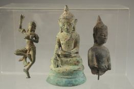 AN EARLY POSSIBLY 12TH CENTURY THAI OR BURMESE GILDED BRONZE BUDDHA, 11cm, together with another two