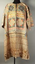 AN ISLAMIC PAINTED TALISMANIC SHIRT, with panels of inscriptions all over and heightened with gilt