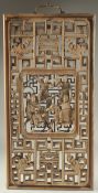 AN EARLY CHINESE CARVED AND PIERCED PANEL, with central relief panel carved with figures on