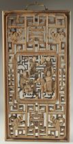 AN EARLY CHINESE CARVED AND PIERCED PANEL, with central relief panel carved with figures on