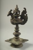 A FINE 17TH CENTURY SOUTH INDIAN BRONZE OIL LAMP, with figural finial in the form of Lakshmi sat