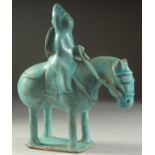 A VERY FINE AND RARE PERSIAN KASHAN TURQUOISE GLAZED POTTERY HORSE AND RIDER, 23.5cm high, 20cm