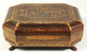 A CHINOSERIE BLACK AND GILT LACQUER GAMING BOX, containing lidded compartments and trays with mother