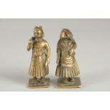 TWO EARLY 19TH CENTURY INDIAN BRASS CHESS PIECES, of a male and female, tallest 7cm high.