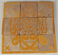 A PANEL OF NINE 18TH-19TH CENTURY NORTH AFRICAN MOROCCAN TILES, overall 30cm x 30cm.