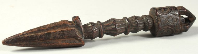 A TIBETAN CARVED WOOD PHURBU / RITUAL DAGGER, 22.5cm long.