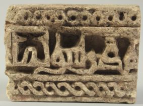 A FINE EARLY ISLAMIC POSSIBLY PERSIAN UNGLAZED POTTERY TILE FRAGMENT, with Kufic calligraphy, 12cm x