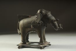 A FINE 18TH CENTURY SOUTH INDIAN BRONZE ELEPHANT, with traces red figment, 17cm long.