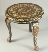 A 19TH CENTURY KASHMIRI LACQUERED WOOD TABLE, painted with colourful flora and gilt highlights, 30.